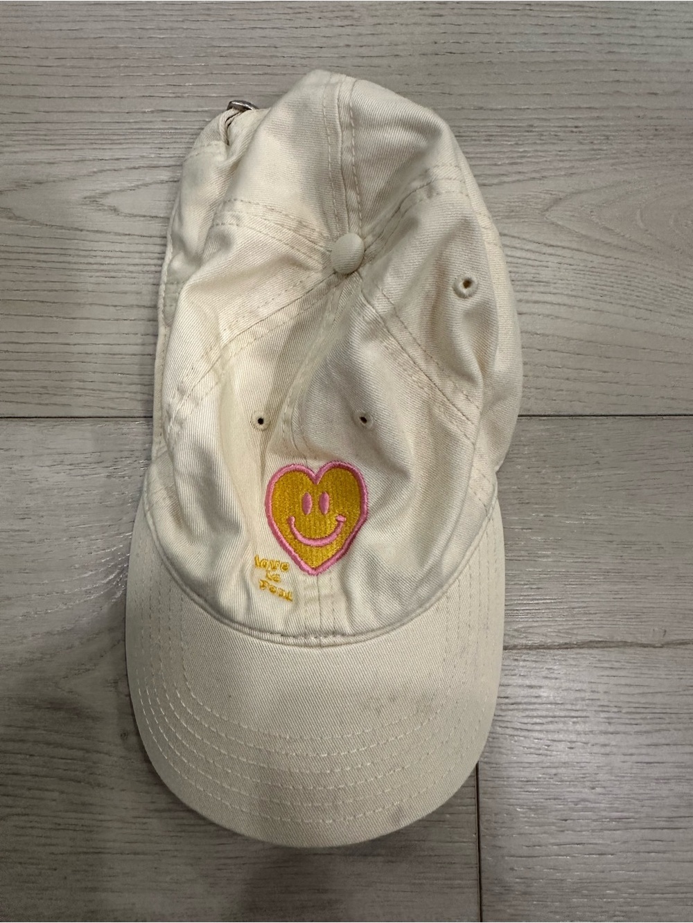 Cream Baseball Cap with Pink & Yellow Heart Smile Patch with staining